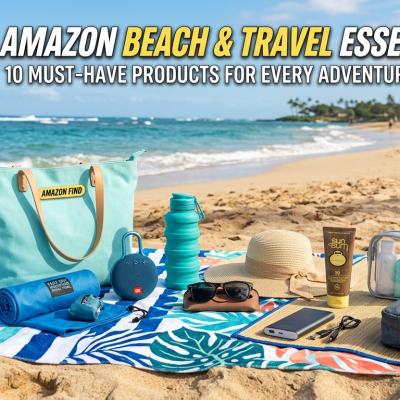 A collection of Amazon beach and travel essentials neatly arranged on a vibrant tropical towel and straw mat on a sandy beach. Items include a mint-green tote bag, a collapsible water bottle, a portable speaker, a microfiber towel, sunglasses, a sun hat, sunscreen, packing cubes, and a clear toiletry bag, with a tropical ocean and palm trees in the background.